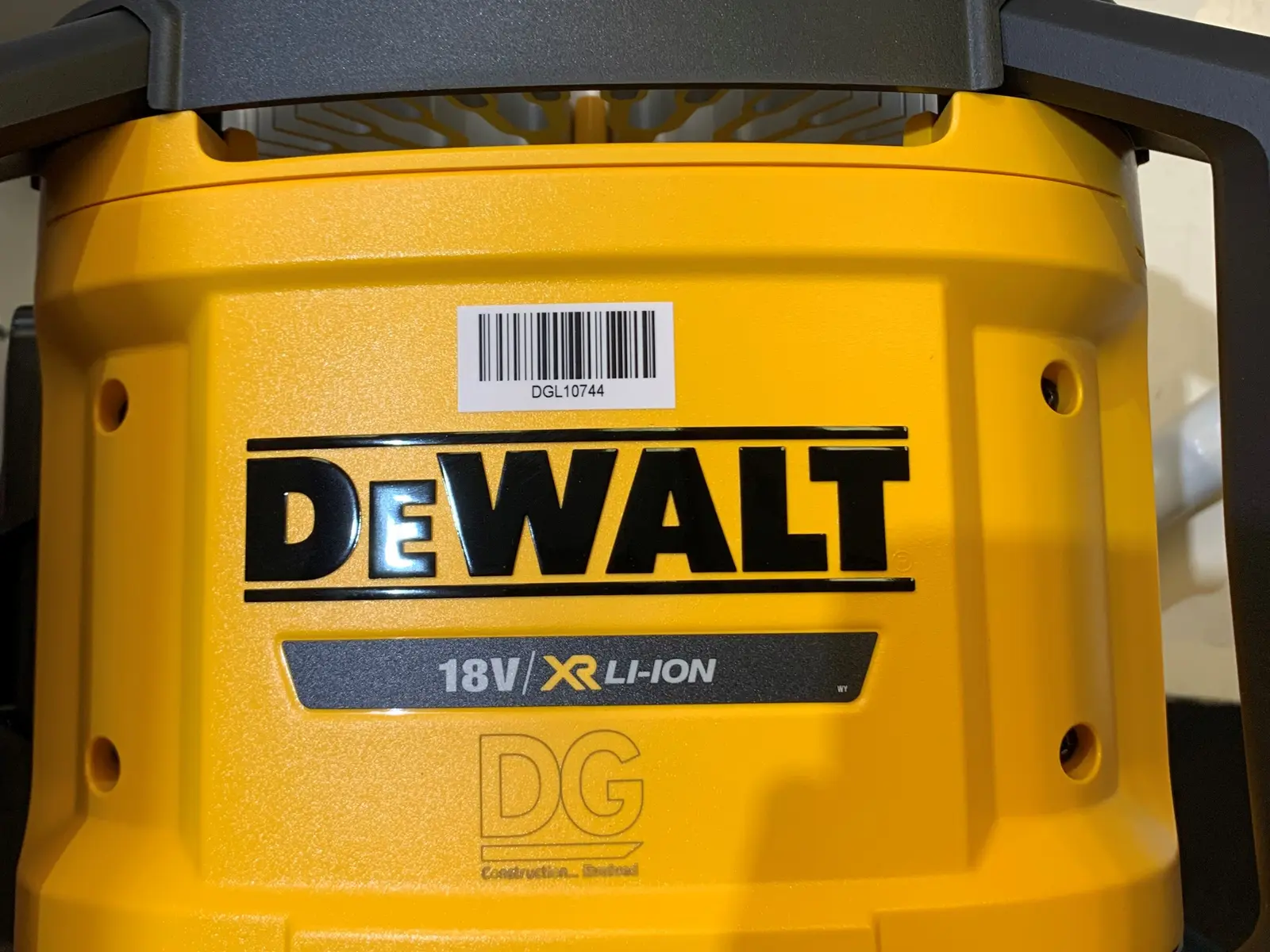 18V site light engraved with a client logo, barcode asset label above